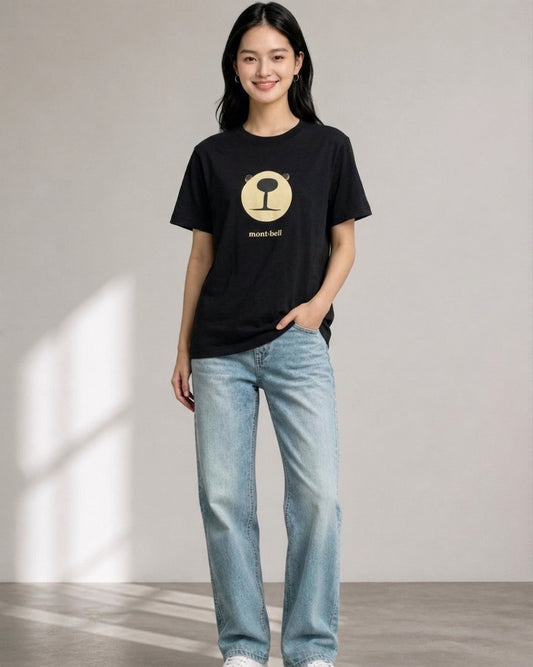 Woman wearing a black Montbell t-shirt with a central Monta Bear face graphic and brand text on the chest