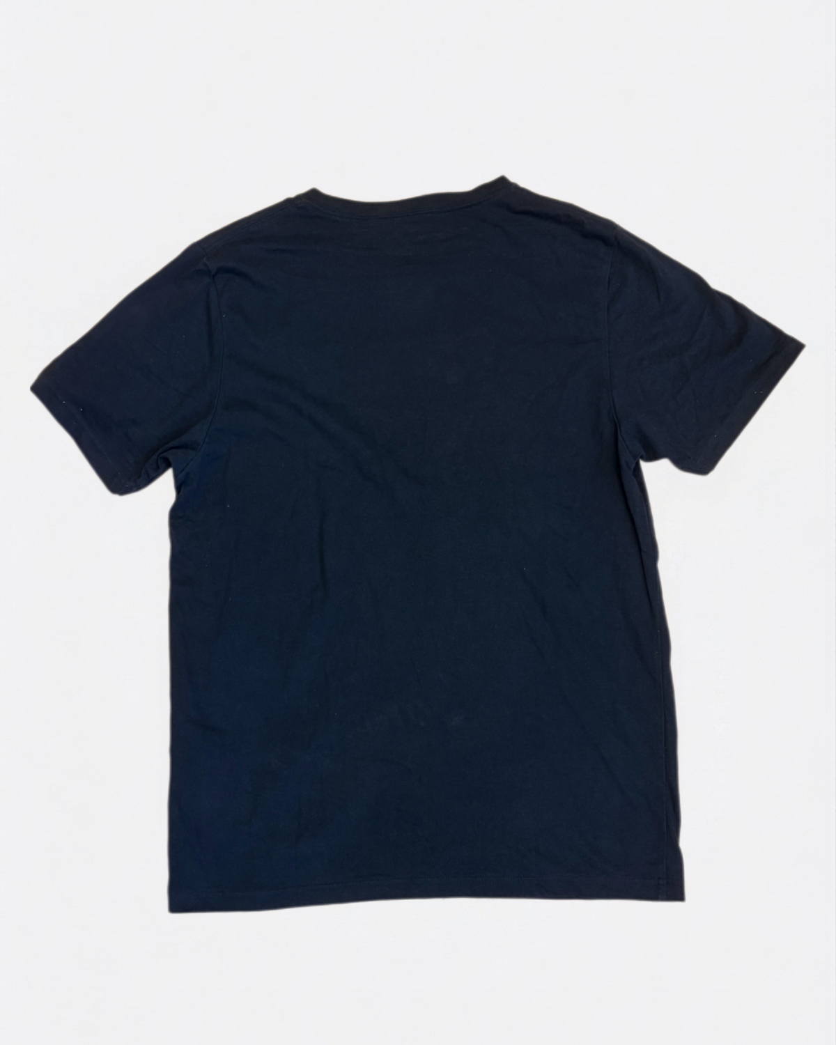 Plain navy blue crewneck cotton t-shirt laid flat, back view