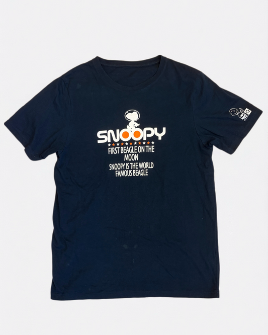 Navy blue Peanuts t-shirt featuring Astronaut Snoopy First Beagle on the Moon graphic text print, front view