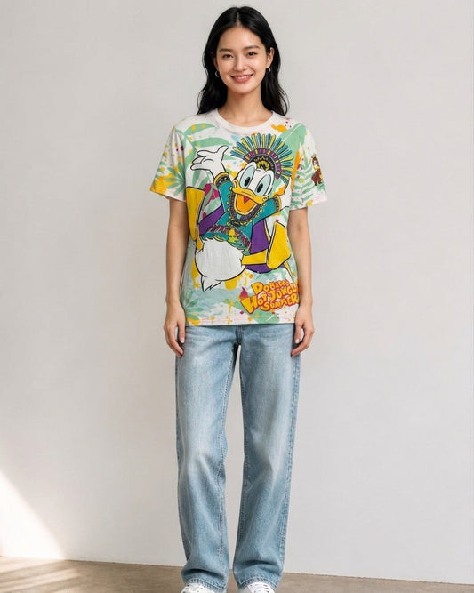 Woman standing in full view wearing a Tokyo DisneySea Donald's Hot Jungle Summer all-over print t-shirt and light blue jeans